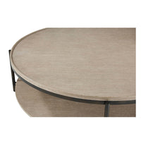 Close-up of round coffee table top and shelf.