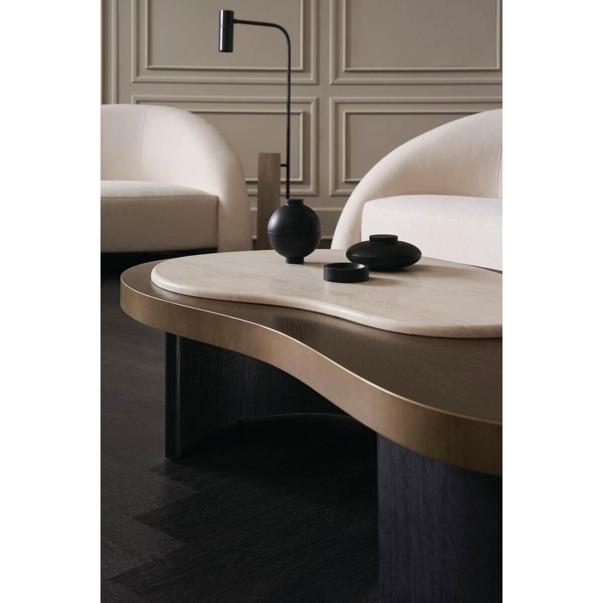 Coffee table in elegant room, decor on top.