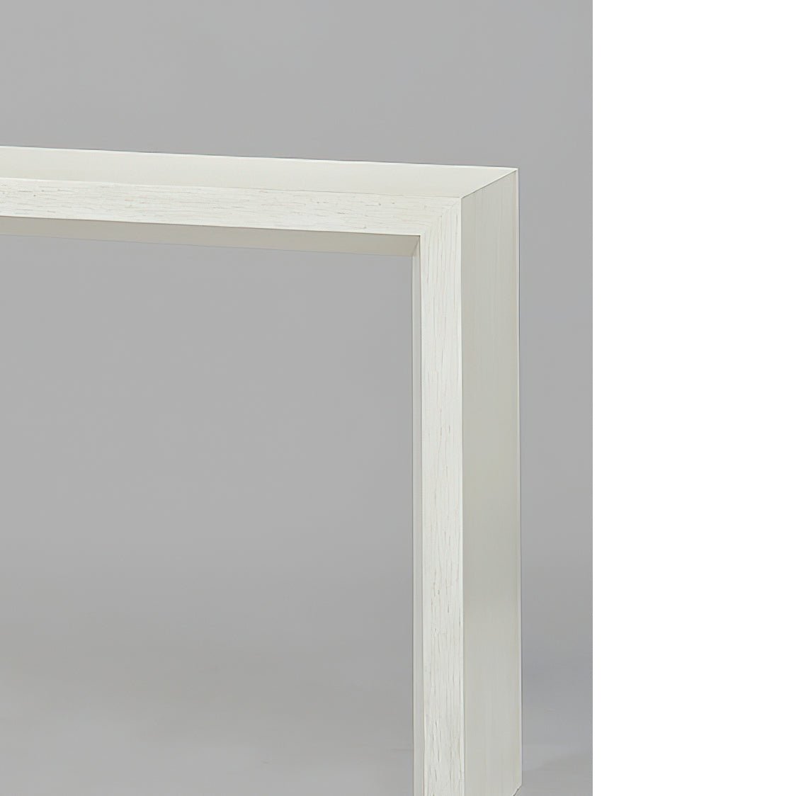 Close-up of console table corner, detailed beveled edge.