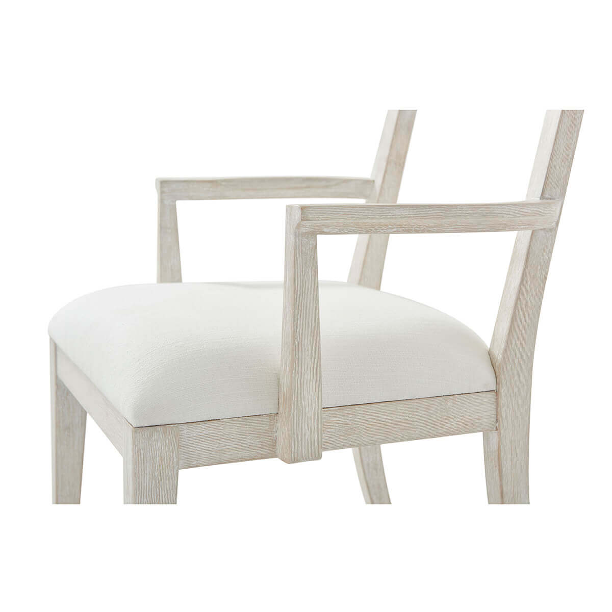Close-up of seat and armrest on dining armchair.