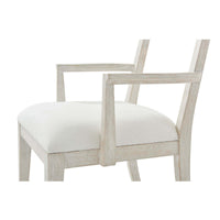 Close-up of seat and armrest on dining armchair.