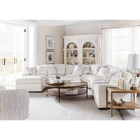 Living room with round coffee table and sectional sofa.