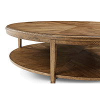 Close-up of round coffee table, oak finish.