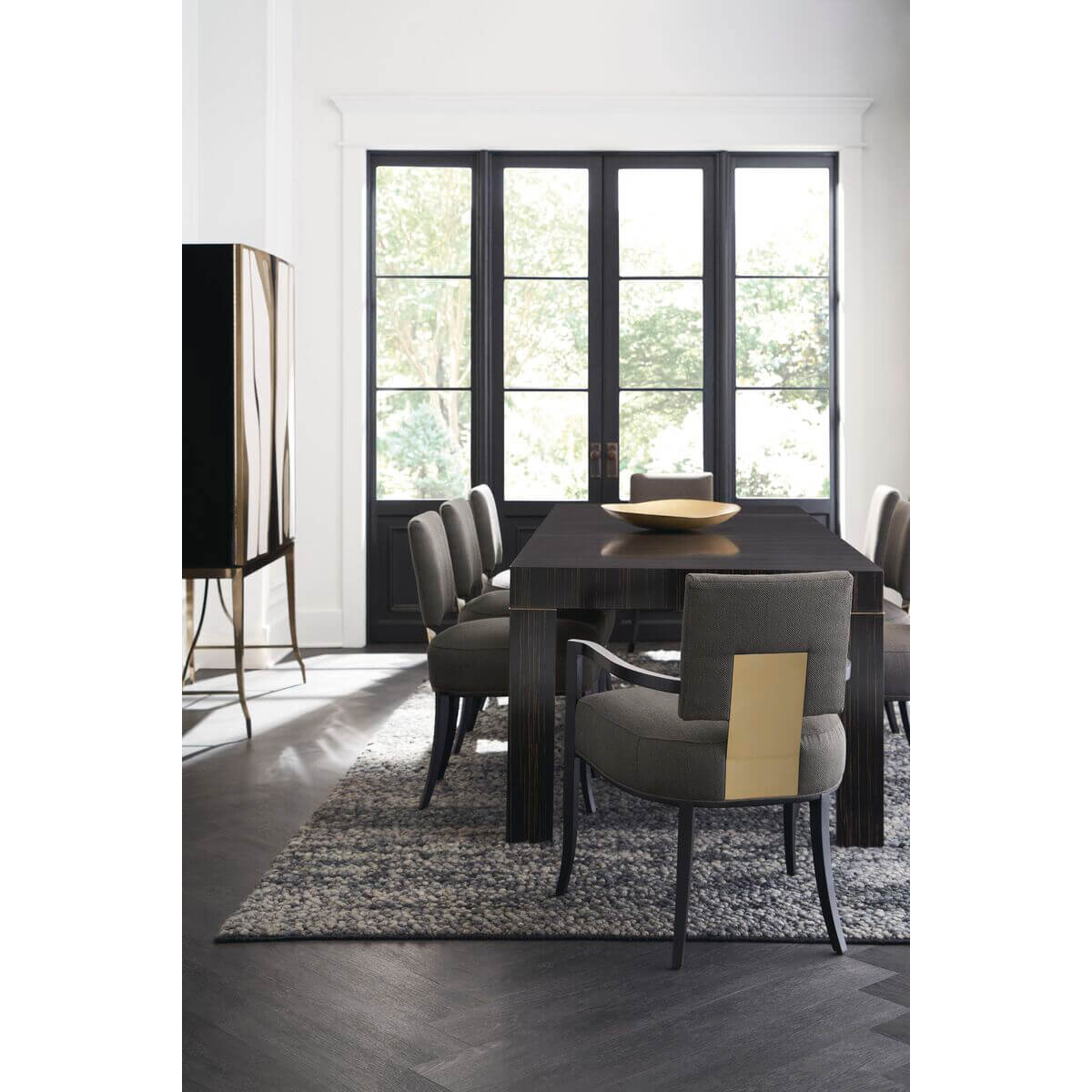 Modern dining table with chairs, bright room view.