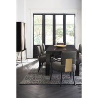 Modern dining table with chairs, bright room view.