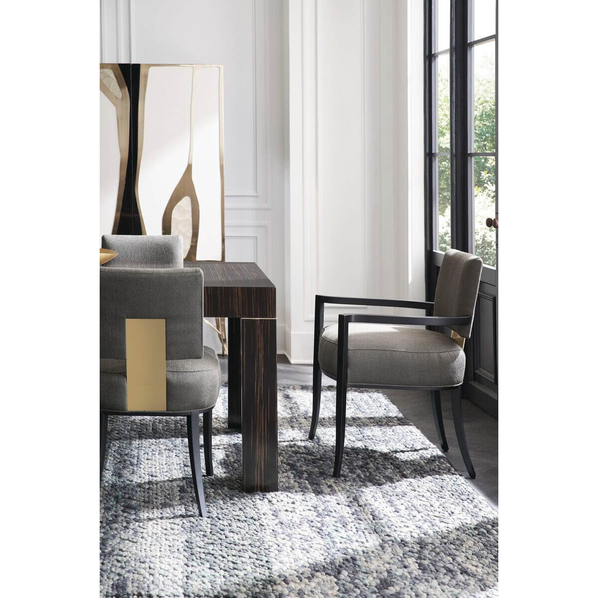 Close-up dining table and chairs, sophisticated decor.