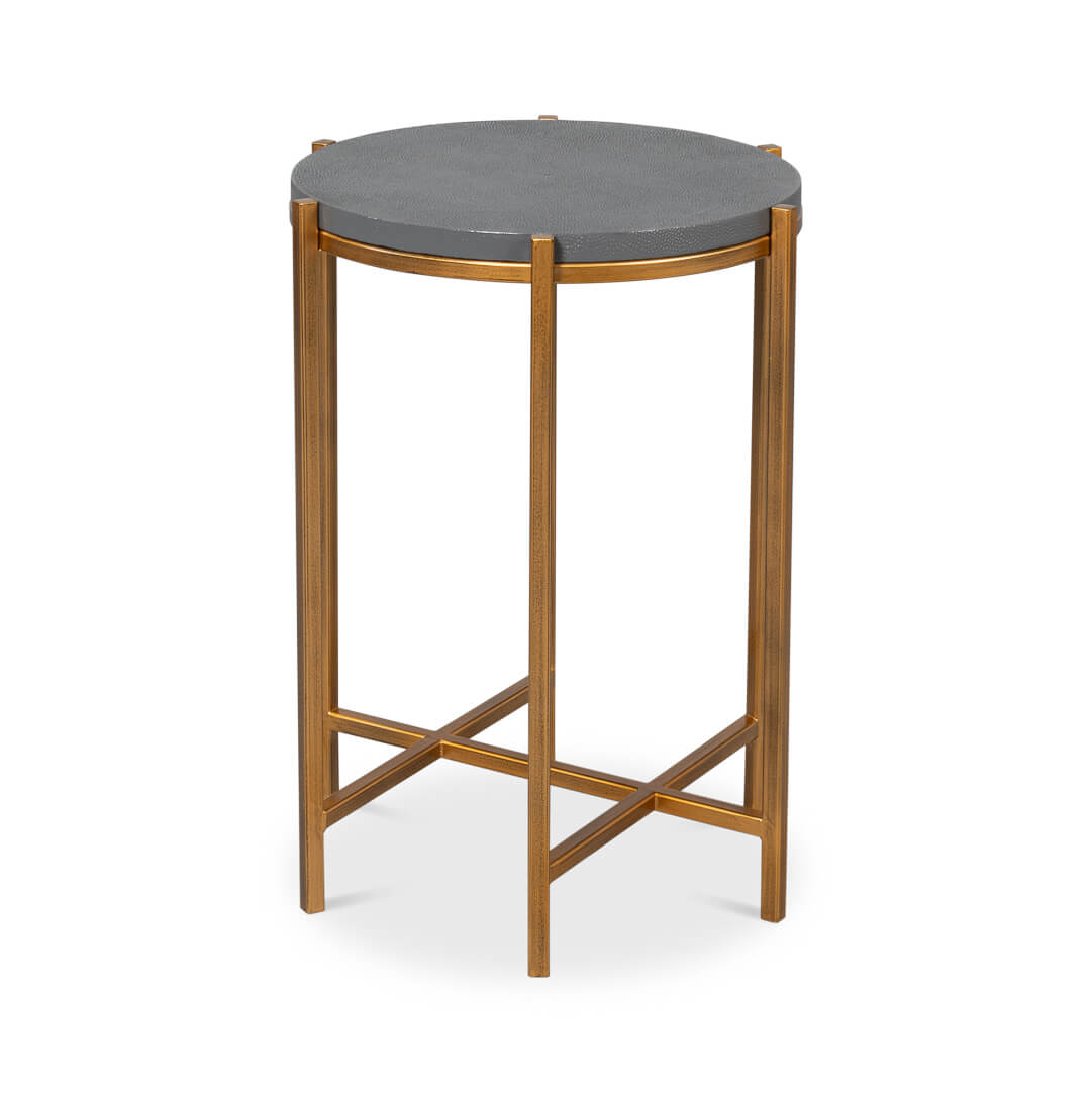 Angled view of accent table with gold legs.