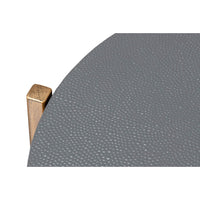 Textured leather surface on accent table top.