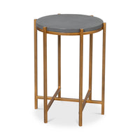 Round accent table with leather top side view.