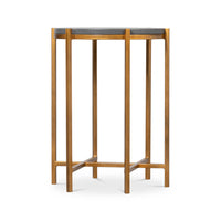 Modern accent table with cross-braced legs.