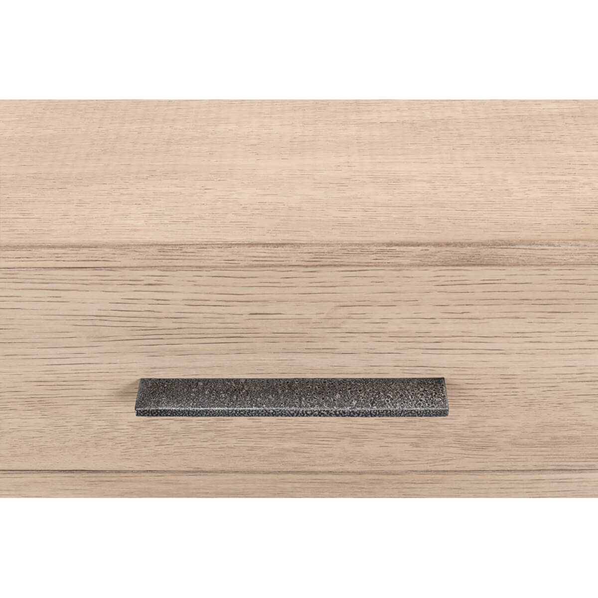 Close-up of modern chest drawer handle detail.