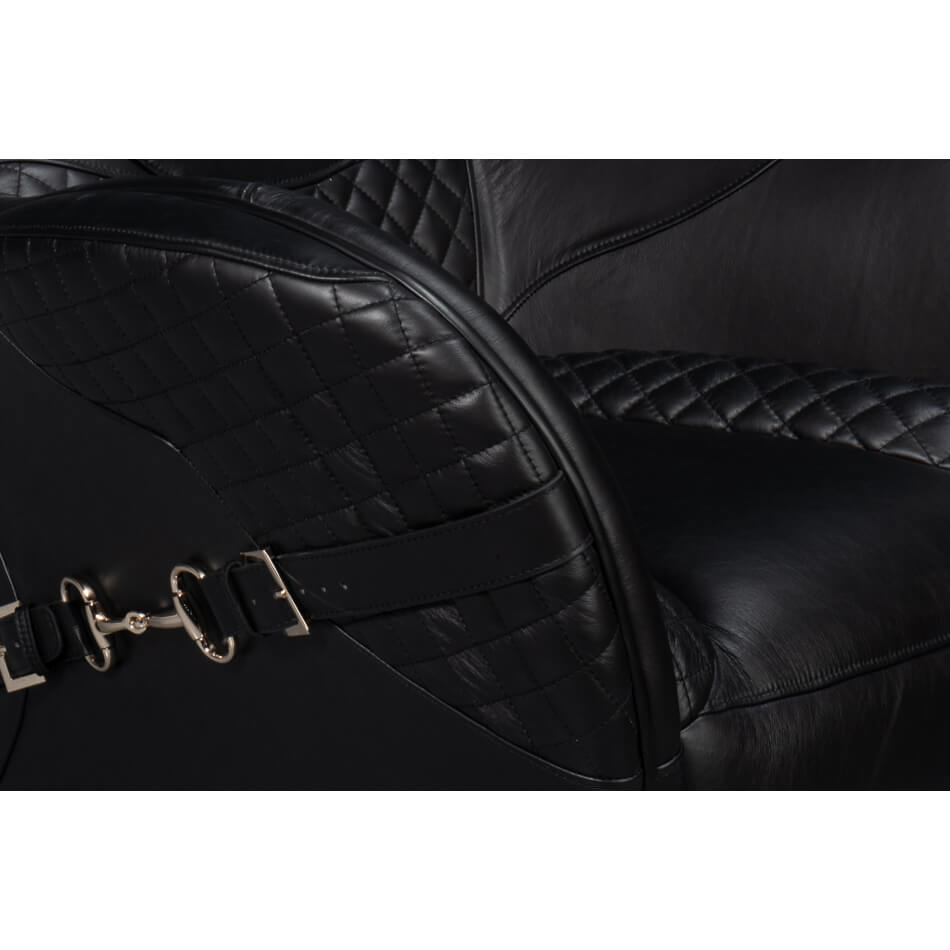 Quilted stitching detail on armchair seat and backrest.