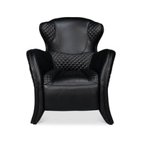 Side profile of black armchair with buckle detail.