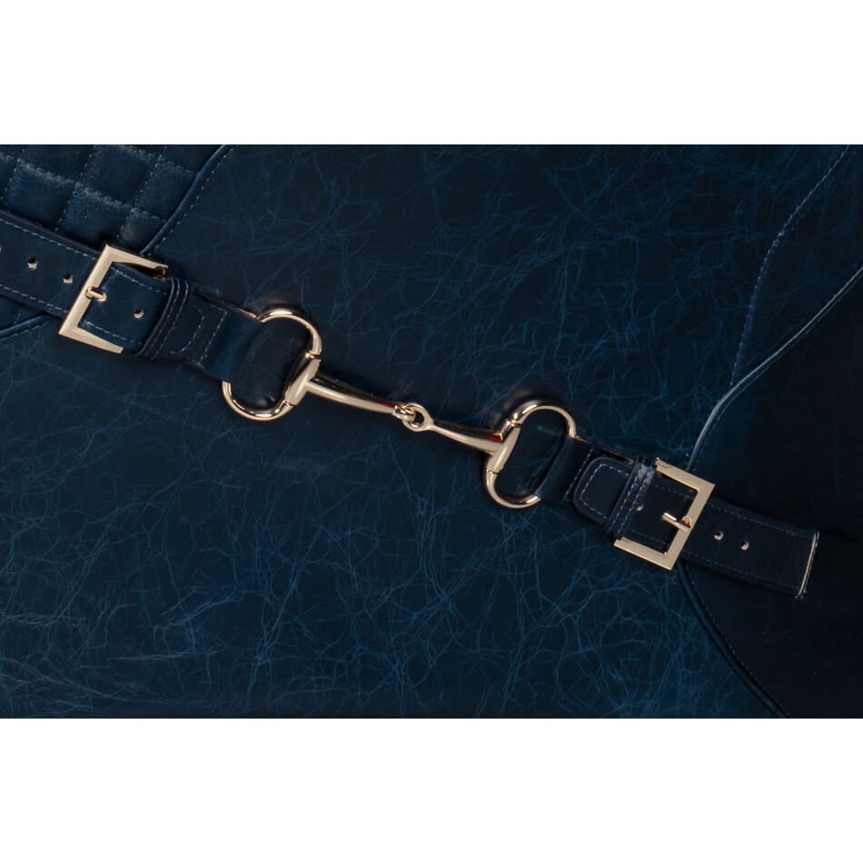 Armchair buckle detail in blue leather.