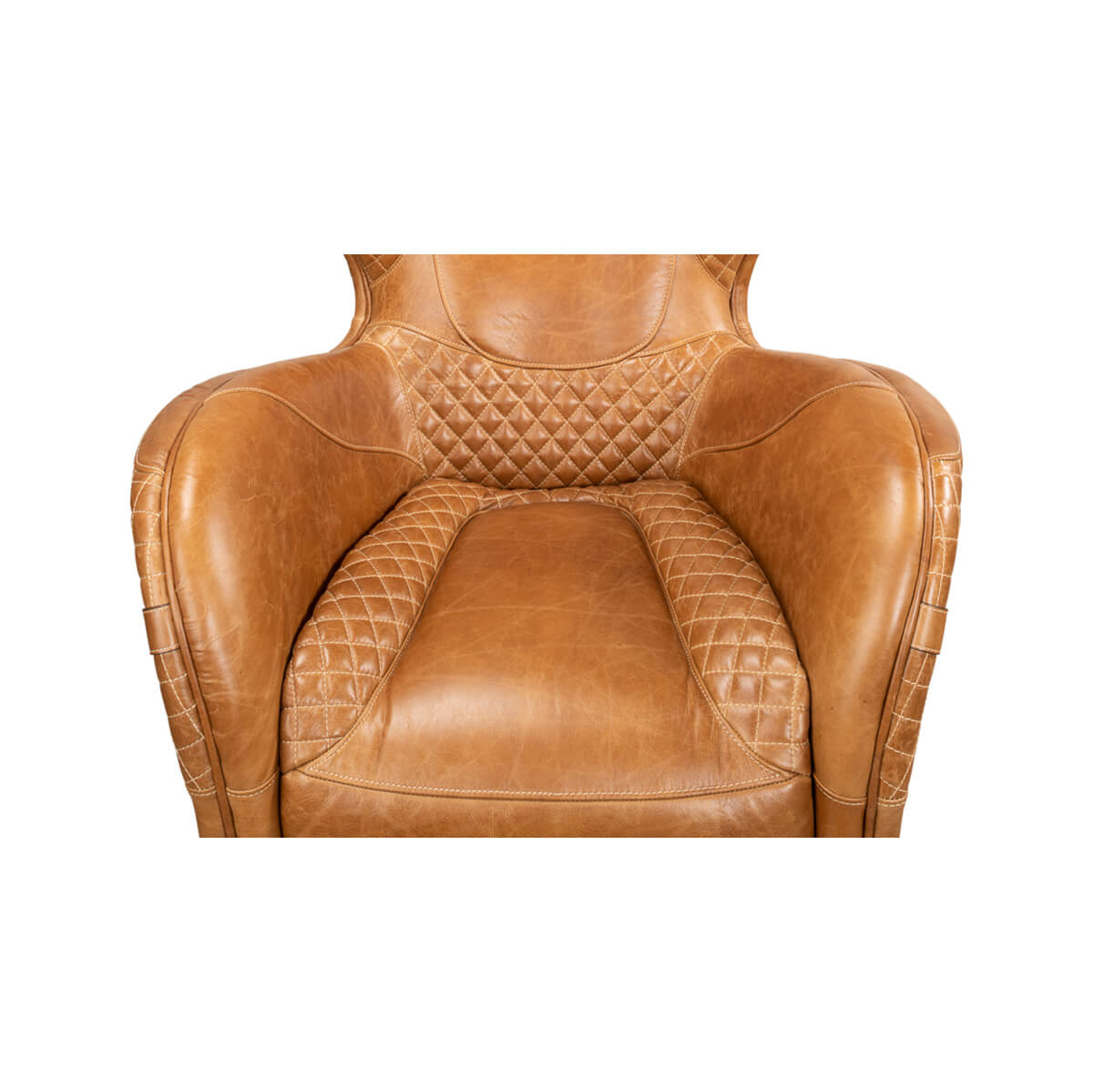Brown quilted leather armchair, top view of seat and arms.