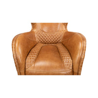 Brown quilted leather armchair, top view of seat and arms.