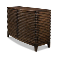 Side angle of ribbed bowfront cabinet, showcasing ribbed design.