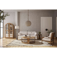 Stylish living room featuring round coffee table centerpiece.