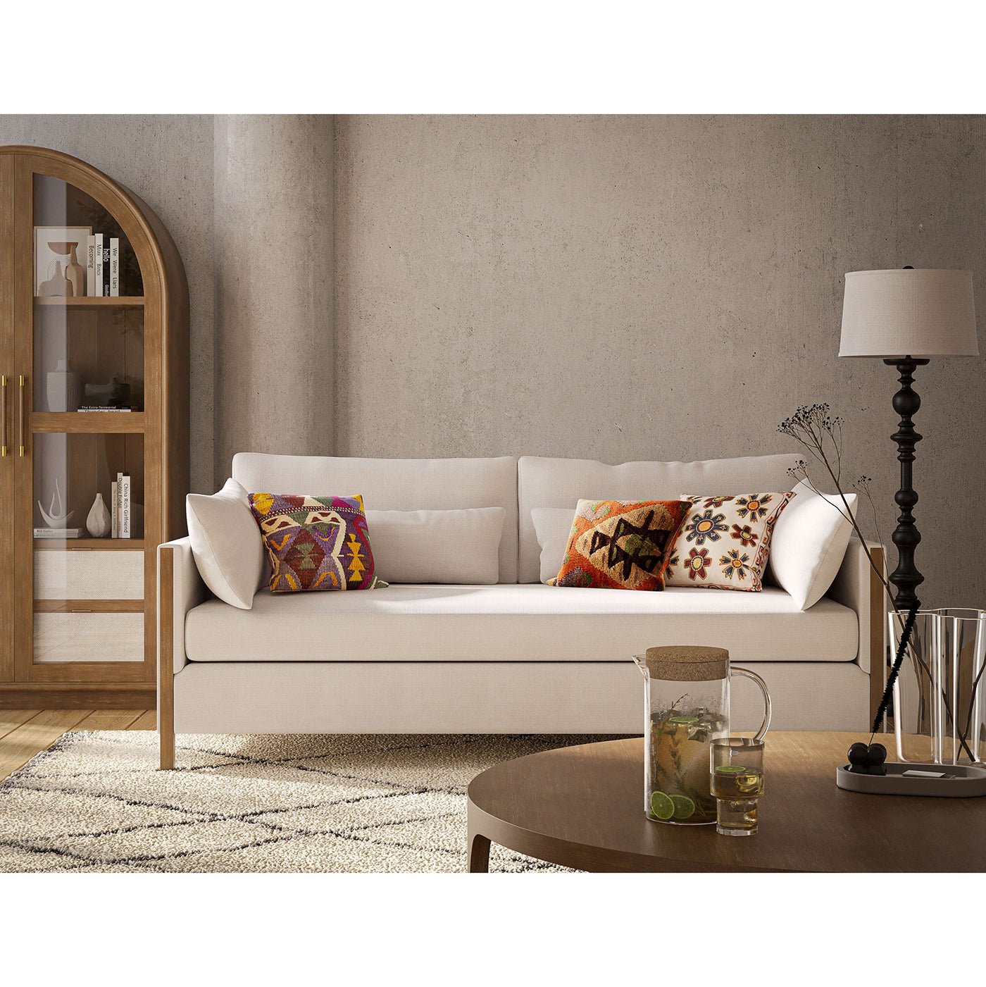 Cozy sofa with colorful pillows, coffee table nearby.