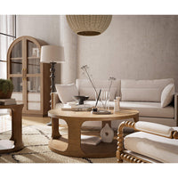 Elegant living room with round coffee table centerpiece.