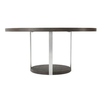 Side profile of round dining table, metal legs visible.