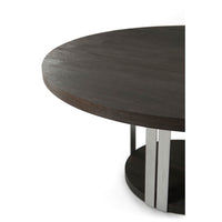 Close-up of round dining table top with metal frame.