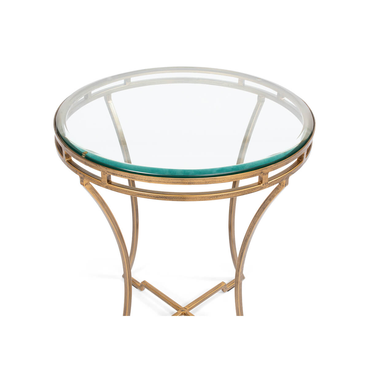 Close-up top view of round gilded end table.