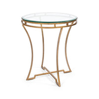Round gilded end table with glass top, angled view.
