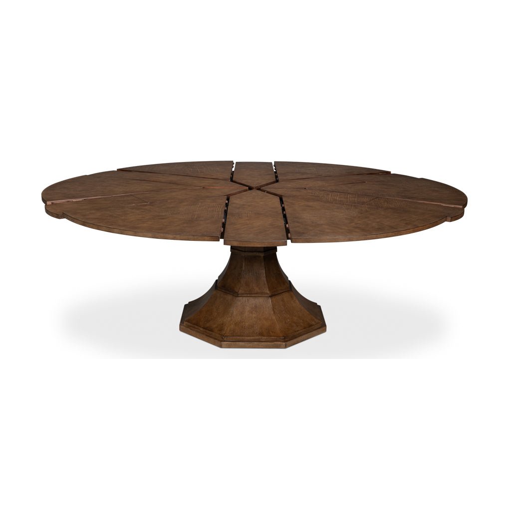 Dining table, partially extended, brown wood, pedestal style.