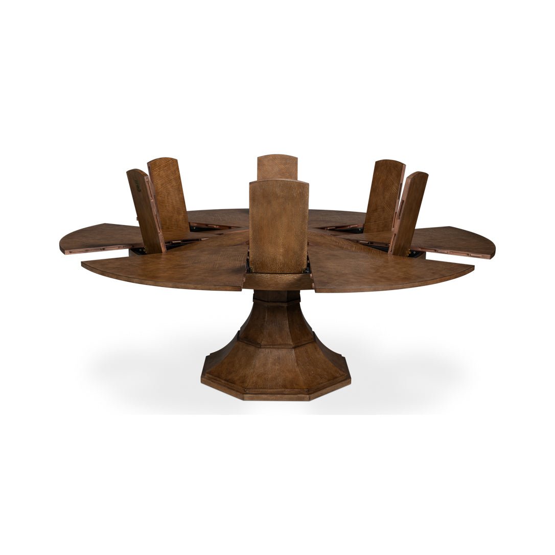 Round jupe dining table expanding with tall segments.