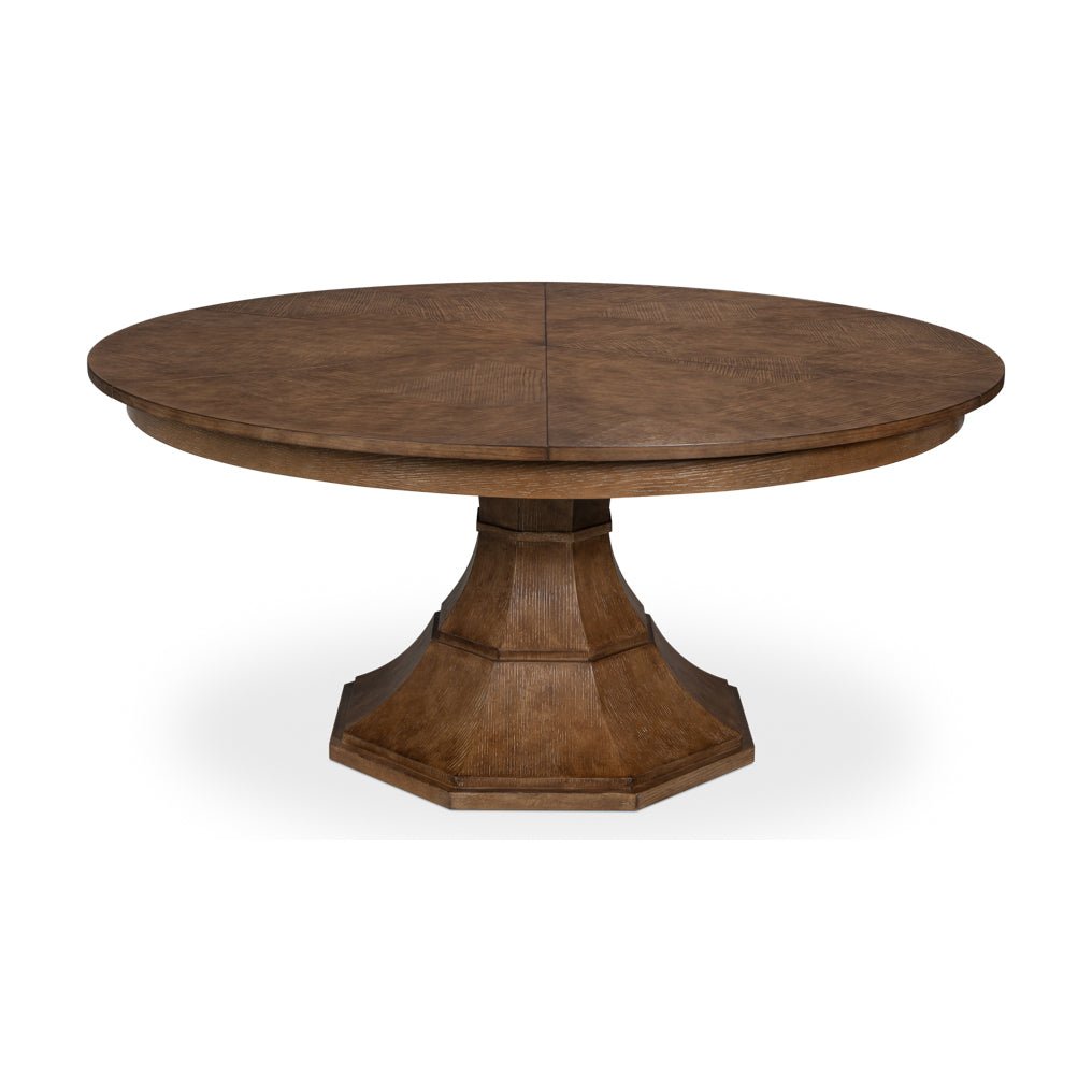 Closed round jupe dining table with pedestal base.