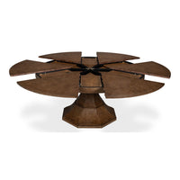 Fully open round jupe dining table with segments.