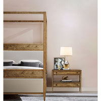Side view of canopy bed with nightstand.