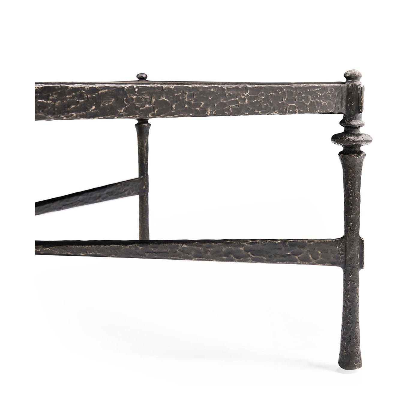 Detail of side and legs on hammered iron coffee table.