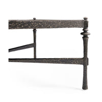 Detail of side and legs on hammered iron coffee table.