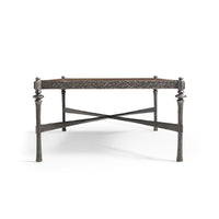 Side view of modern rustic hammered iron coffee table.