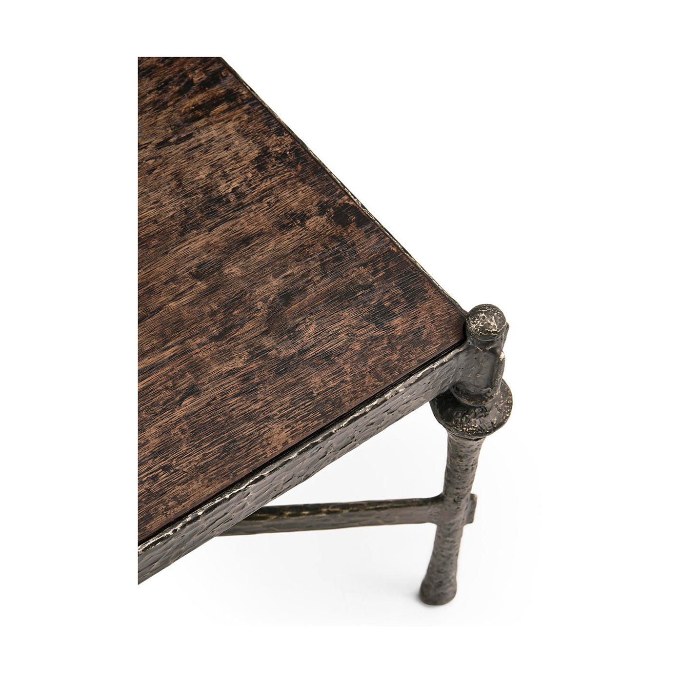 Detail of corner and edge on rustic hammered iron table.