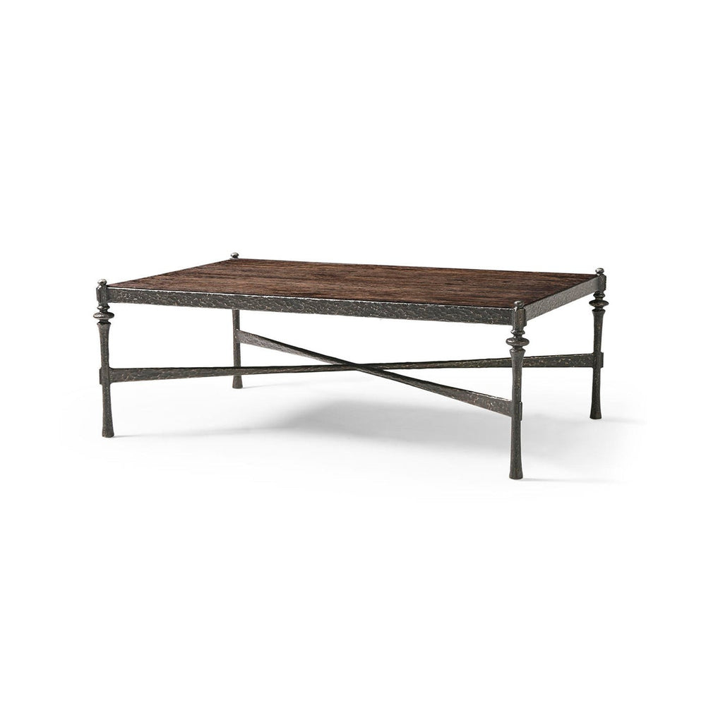 Angled view of modern rustic hammered iron coffee table.