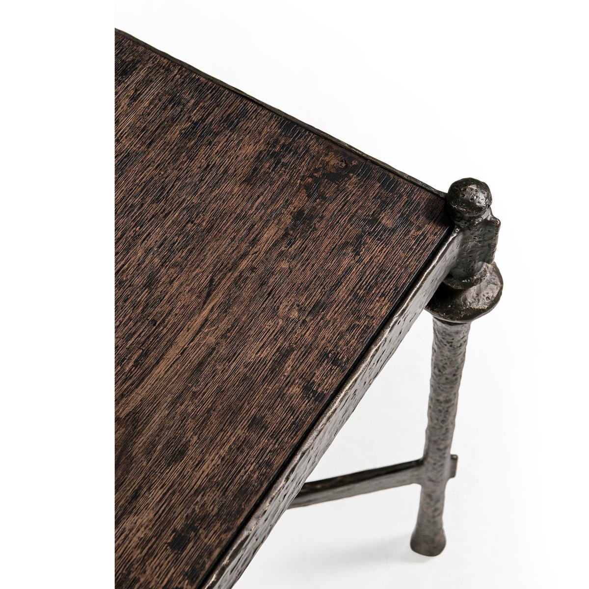 Edge detail of rustic iron side table, unique texture.