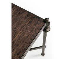 Edge detail of rustic iron side table, unique texture.