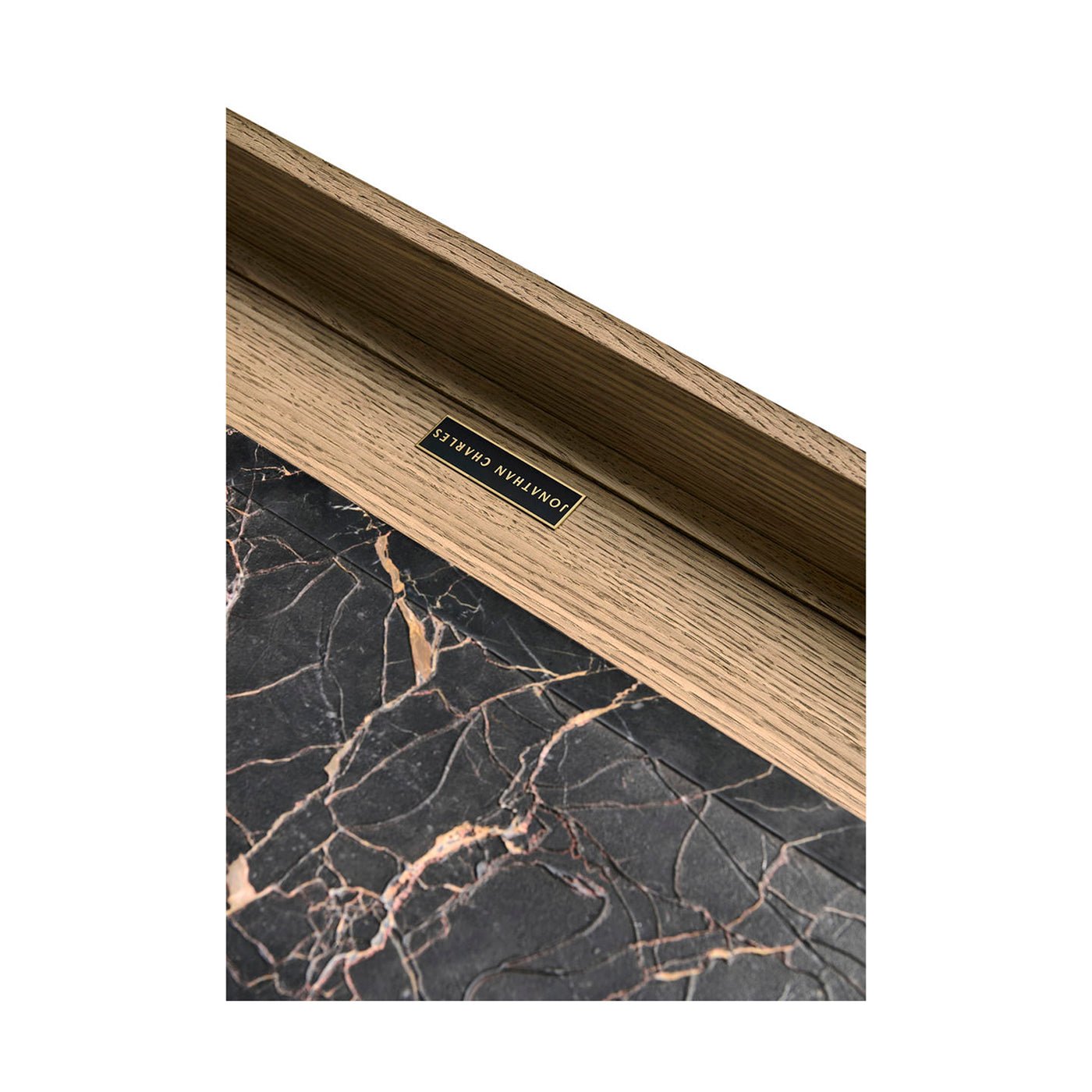 Drawer interior with marble top coffee table detail.