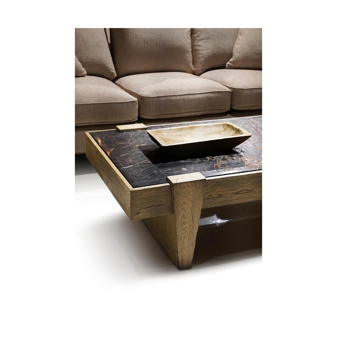 Coffee table styled with tray beside sofa.