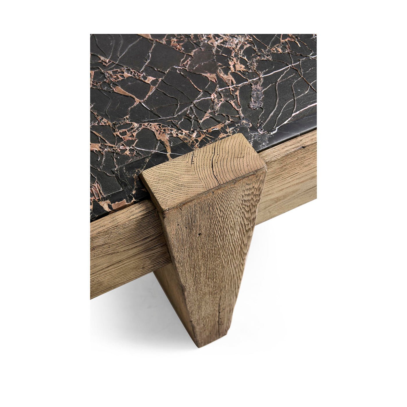 Table leg detail of marble and oak coffee table.
