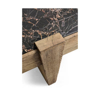 Table leg detail of marble and oak coffee table.