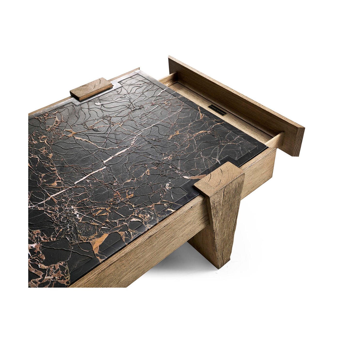 Open drawer with marble and oak coffee table.