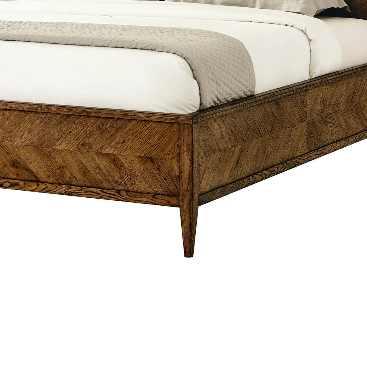 Side view of oak bed frame with footboard.