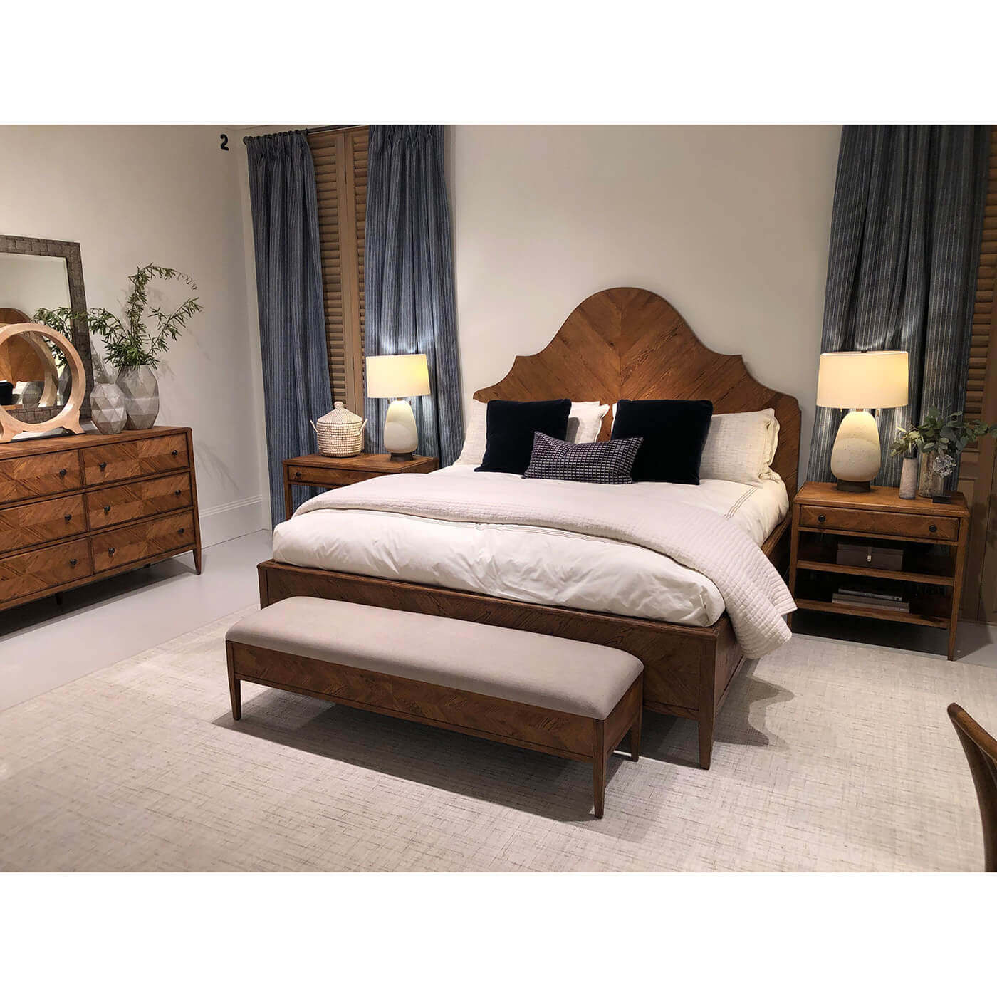 Bedroom setting with oak bed and matching furniture.