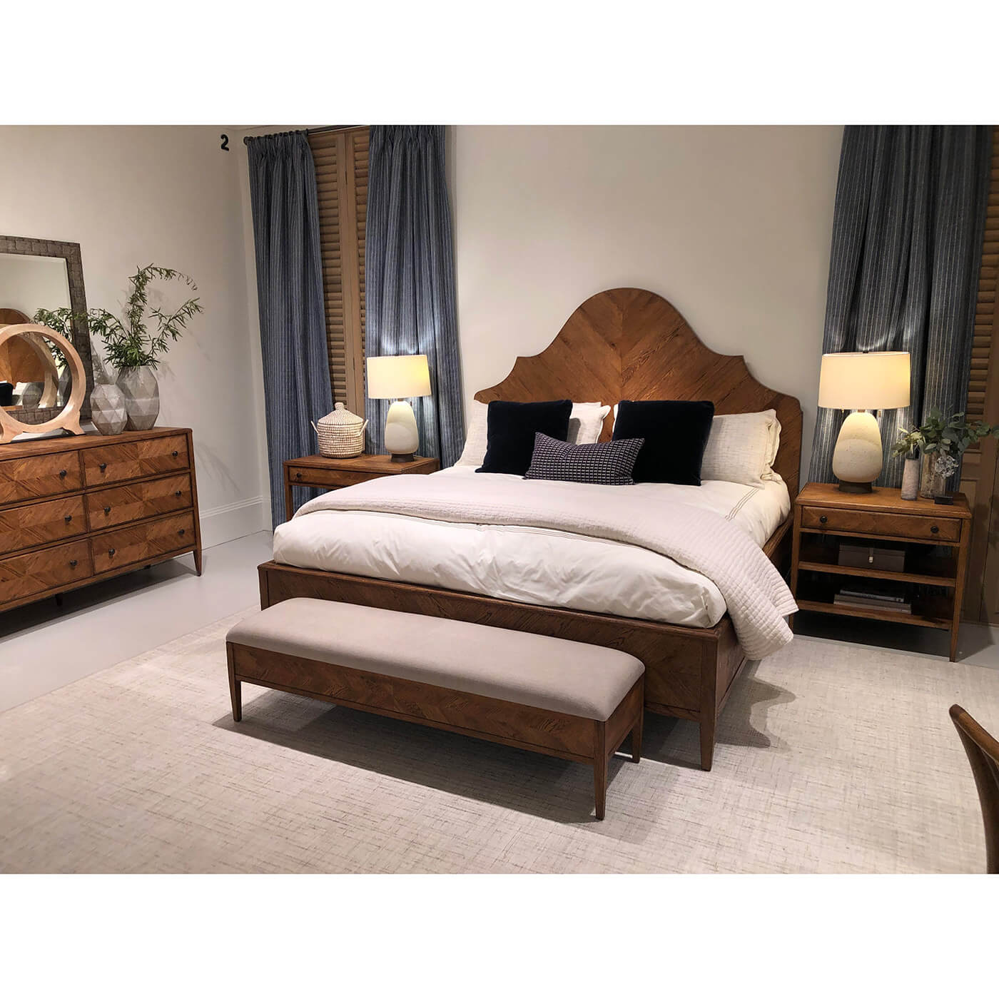 Modern rustic oak king bed in furnished bedroom.