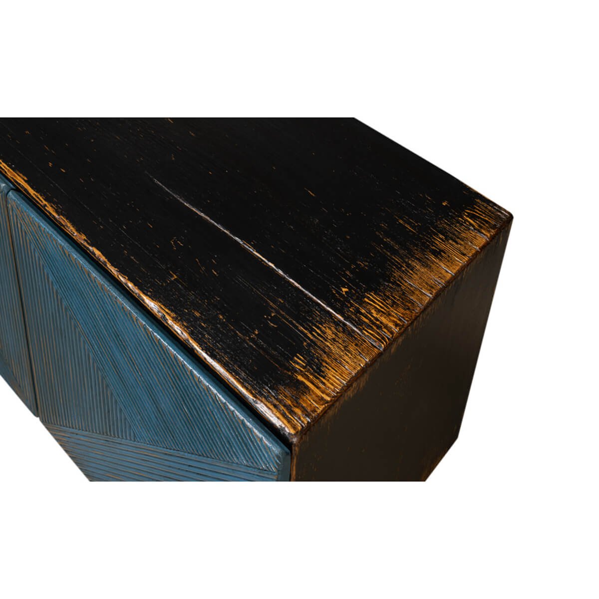 Close-up of cabinet's distressed black top.