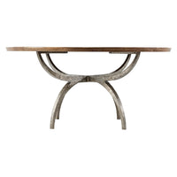 Side angle of modern rustic round dining table with curved base.